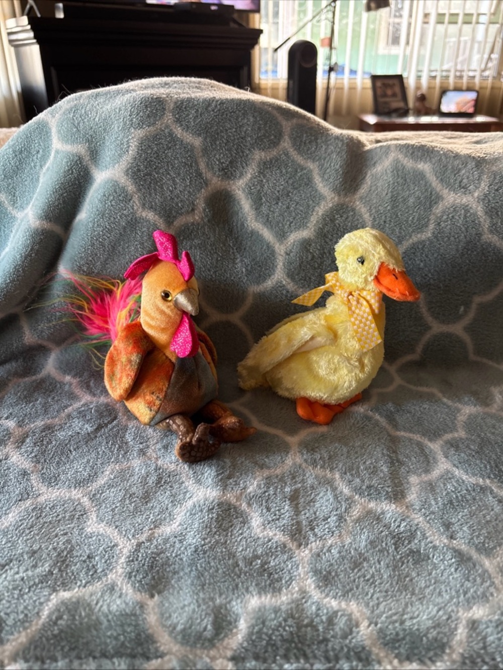 Ty Beanie Baby Zodiac Rooster (left) and a Ty Beanie Baby Duck (right).